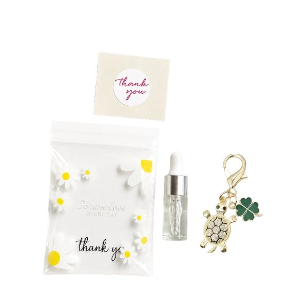 Darilno pakiranje Cuticle Oil Lemon + obesek za ključe